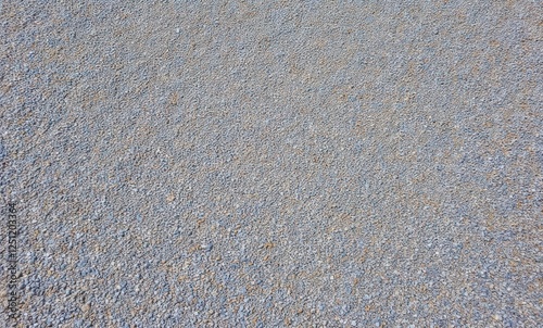 Textured gravel surface with small stones photo