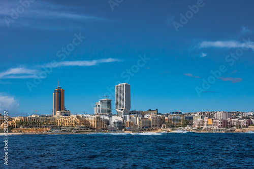 Malta-San Giuliano panorama citta con mare palme navi  grattacieli  photo