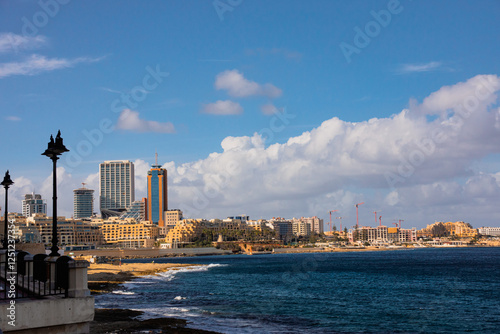 Malta-San Giuliano panorama citta con mare palme navi  grattacieli  photo