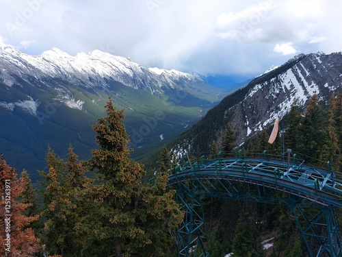 Banff gondola rail on Sulphur Mountain, Rockies, Banff National Park, Calgary, Alberta, Canada. Snow covered Mount Rundle in background. photo