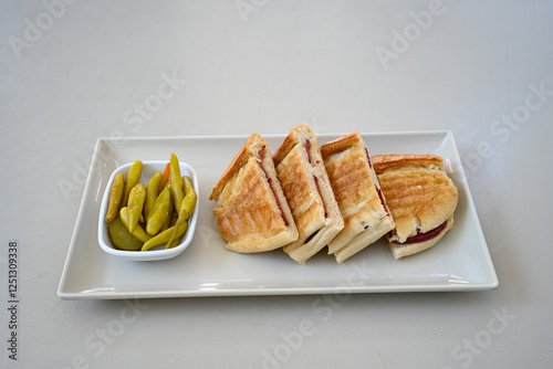 Turkish karisik atom Ayvalik tost ( kasarli bazlama tost) . Sucuklu, Kasarli, kavurmali karisik tost. Flat baked bread toasted. Karisik bazlama tost .   photo