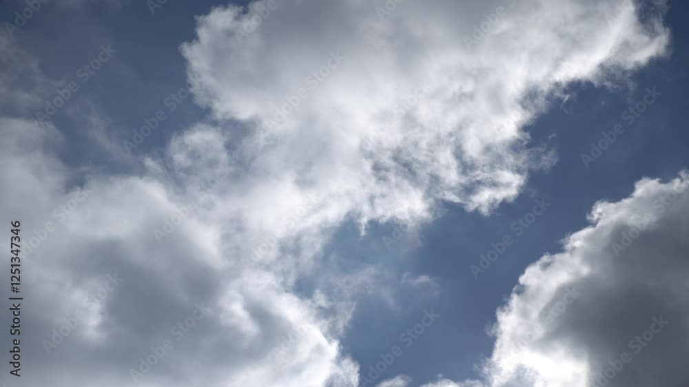Floating blue sky cotton candy clouds in time lapse reveal stunning daytime transformations Floating blue sky cotton candy clouds in time lapse reveal stunning daytime transformations