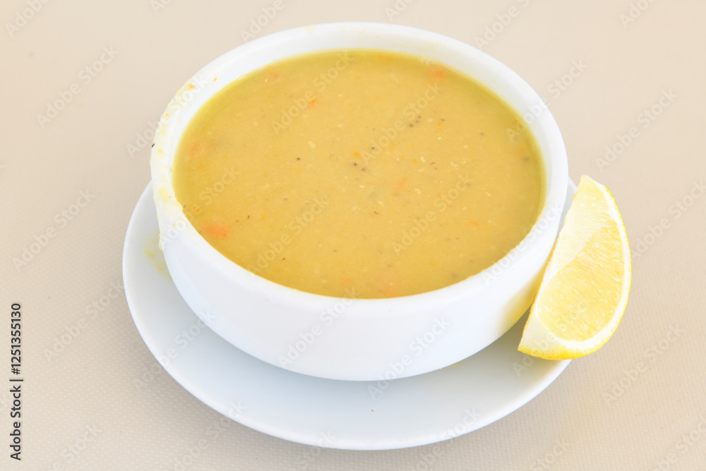 Lentil ( mercimek corbasi ) soup with melted butter and red pepper sauce. Limon ve soslu mercimek corba. Lentil ( mercimek corbasi ) soup with melted butter and red pepper sauce. Limon ve soslu mercimek corba.