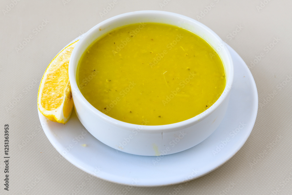 Lentil ( mercimek corbasi ) soup with melted butter and red pepper sauce. Limon ve soslu mercimek corba. Lentil ( mercimek corbasi ) soup with melted butter and red pepper sauce. Limon ve soslu mercimek corba.