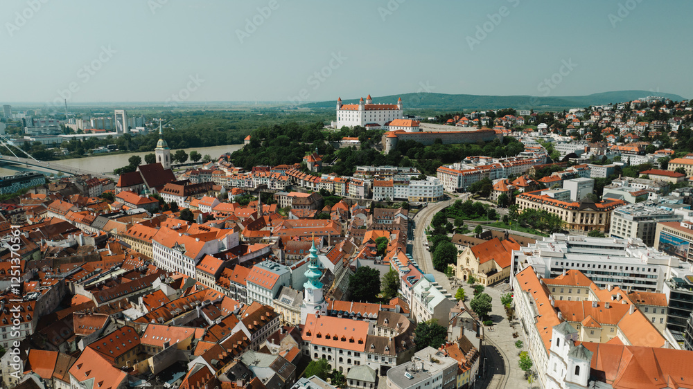 Fototapeta premium Bratislava old town view castle and city church in city centre. bratislavy skyline aerial view drone footage of bratislava slovakia city.