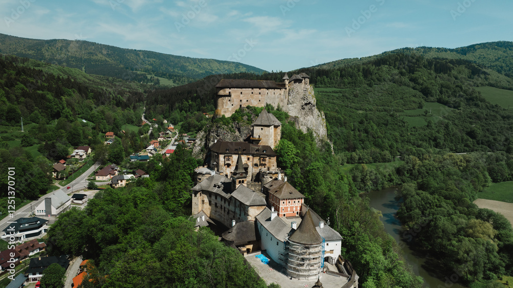 Obraz premium Orava castle - Oravsky Hrad in Oravsky Podzamok in Slovakia. Medieval stronghold on extremely high and steep cliff by the Orava river.