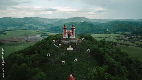 Beautiful aerial shot of a late Baroque Calvary, Church on hill in Banska Stiavnica, Slovakia