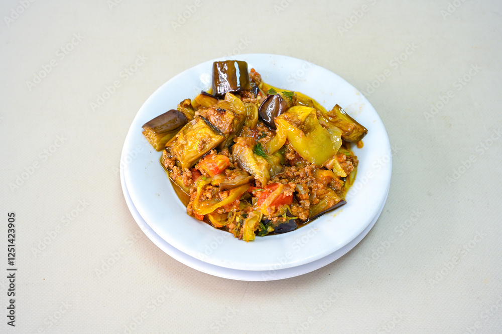Meat with eggplant and pepper.Cooked with vegetables and hot spices. Patlican kebab, musakka. Meat with eggplant and pepper.Cooked with vegetables and hot spices. Patlican kebab, musakka.