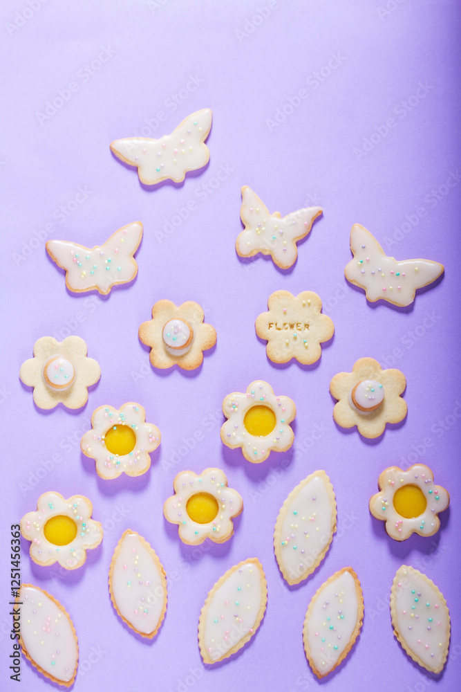 Shortbread cookies with lemon filling in the shape of butterflies, flowers and leaves.