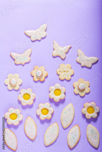 Obraz na płótnie Shortbread cookies with lemon filling in the shape of butterflies, flowers and leaves. w salonie