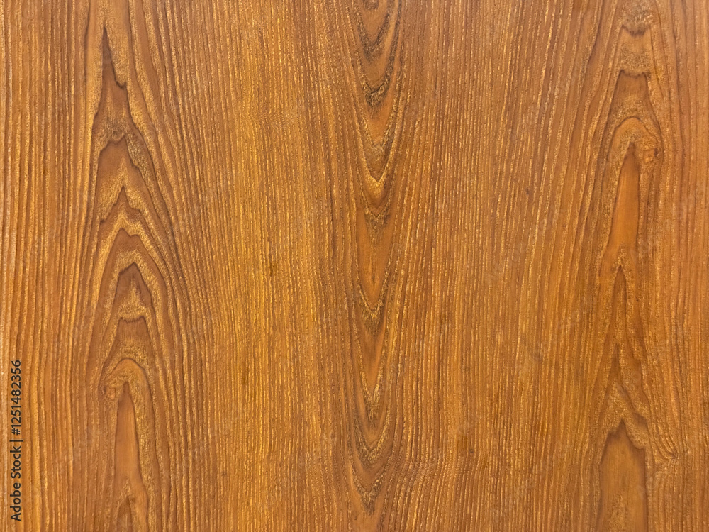 Close up of solid wood veins texture. Bright natural yellow brown wood with its typical veins on a wall panel. Suitable for wall covering. Seamless background texture