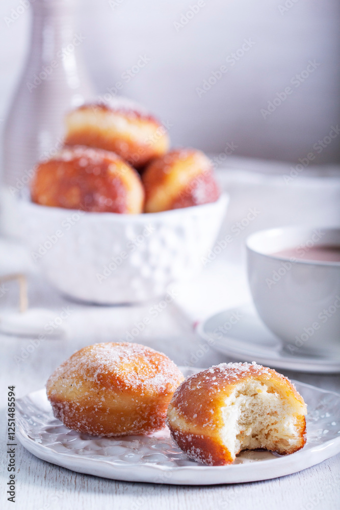 Donuts with sugar and cinnamon served with cocoa. Traditional dessert for Carnival.