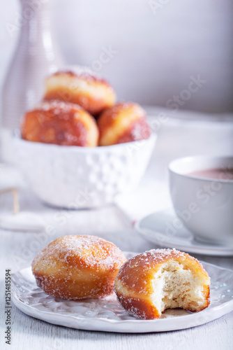 Obraz na płótnie Donuts with sugar and cinnamon served with cocoa. Traditional dessert for Carnival. w salonie