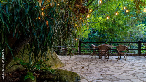 Table and chairs on a private setting in the forest.