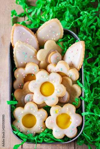 Obraz na płótnie Shortbread cookies with lemon filling in the shape of butterflies, flowers and leaves. w salonie