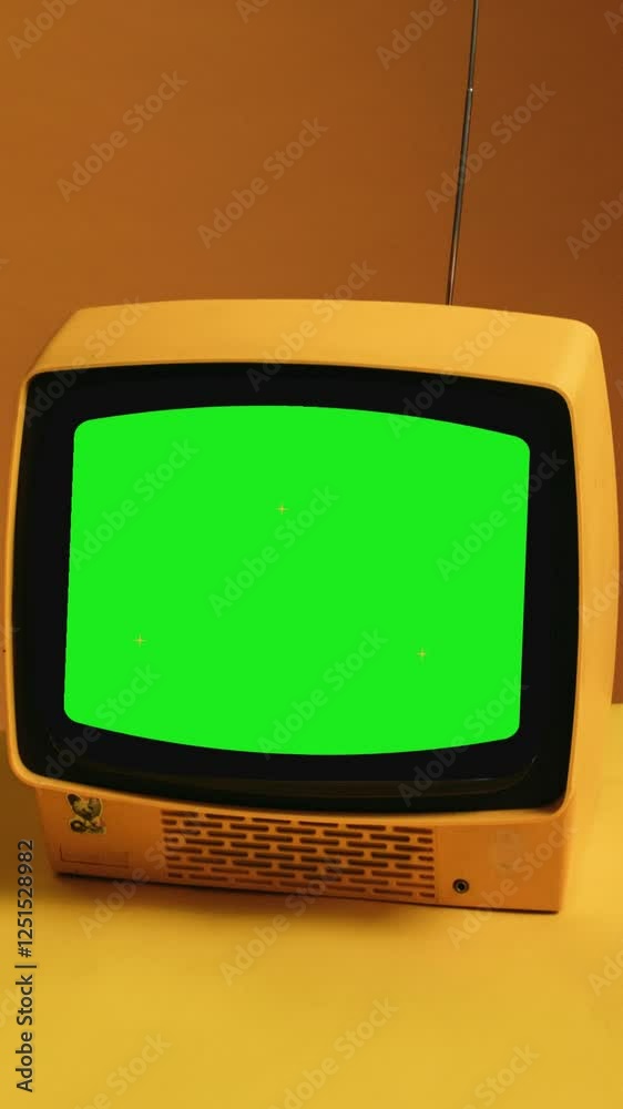  Old yellow Broken TV with Green Screen. You can replace green screen with the footage or picture you want.