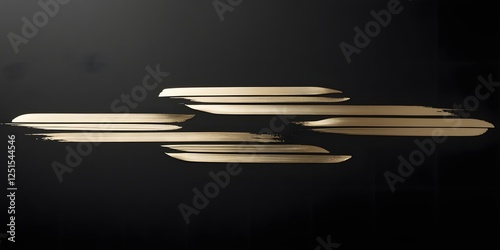 A series of gold ink brush strokes forming a minimalistic geometric design on a crisp black page5 photo