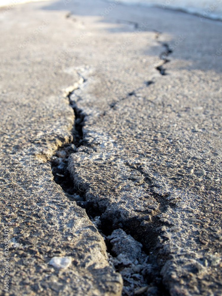 Crack in the pavement is shown in the image Crack in the pavement is shown in the image