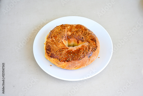 Turkish pastry product , tasty pogaca, acma . Simit, gevrek. Turkish Pastries; peynirli, patatesli, kasarli pogaca, sosili acma, dereotlu pogaca,  borek, acma, ay coregi at patisserie showcase. photo