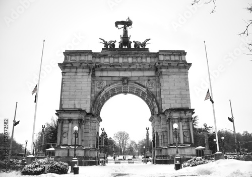 grand army plaza arch view covered in snow during winter at entrance to prospect park in brooklyn new york city (famous landmark during snowstorm blizzard) beautiful wintry cityscape flatbush union st photo