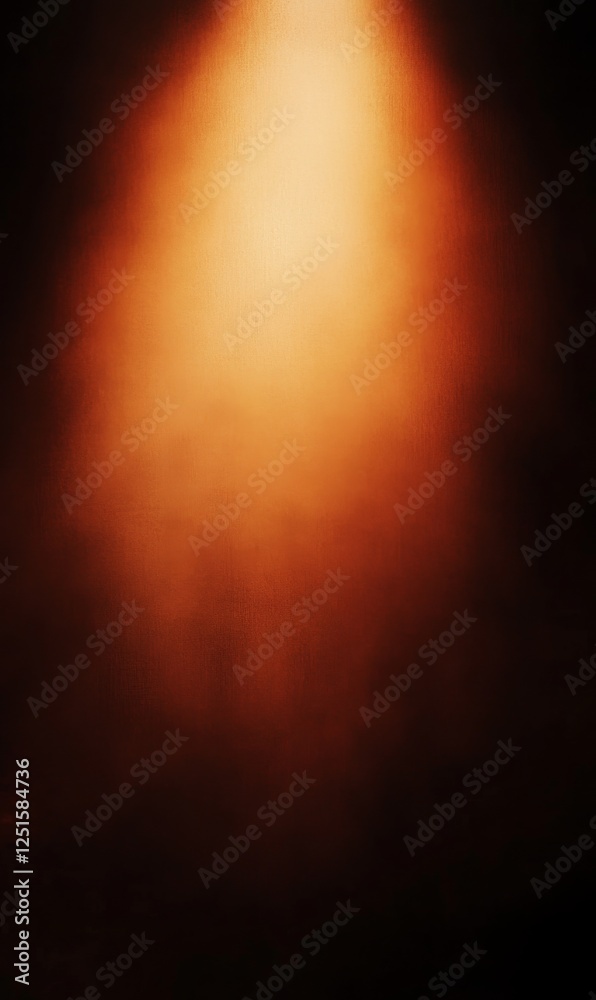 Fototapeta premium Ethereal glow emanates from above, casting warm amber tones across a textured dark backdrop