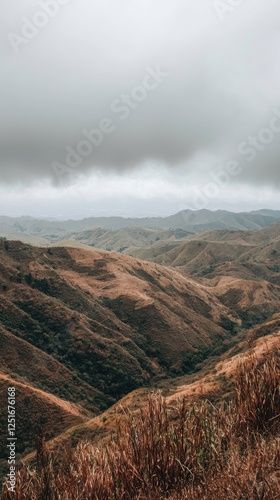 Mountain valley landscape under cloudy sky. Possible use Nature photography photo