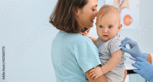 Pediatrician vaccinating li...