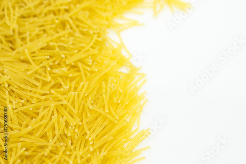 Uncooked vermicelli Pasta with Copy Space on White Background. Raw and Dry vermicelli.