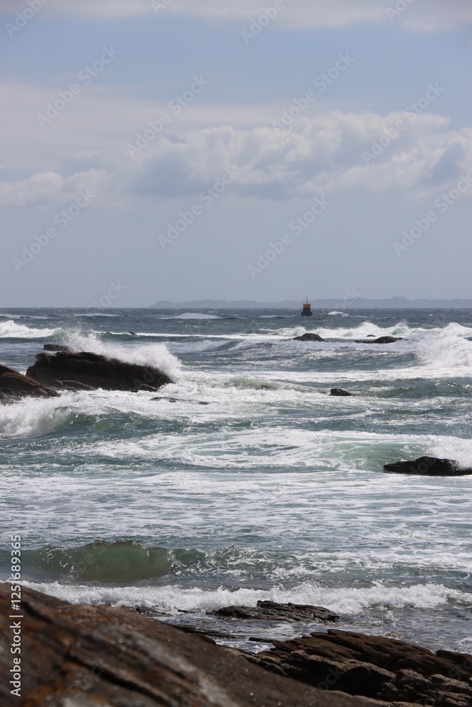 waves with storm crashing on rocks in Quiberon, France