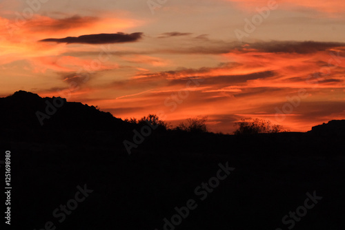 Fototapeta Naklejka Na Ścianę i Meble -  Oramge sunset in the desert southwest mountains