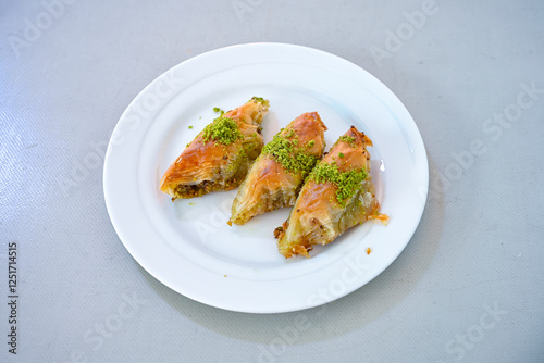 Turkish Dessert Sobiyet, havuc dilimi, midye baklava, mussels baklava and classic baklava with Pistachio . Cikoltali cevizli, fistikli soguk Baklava, top view. photo