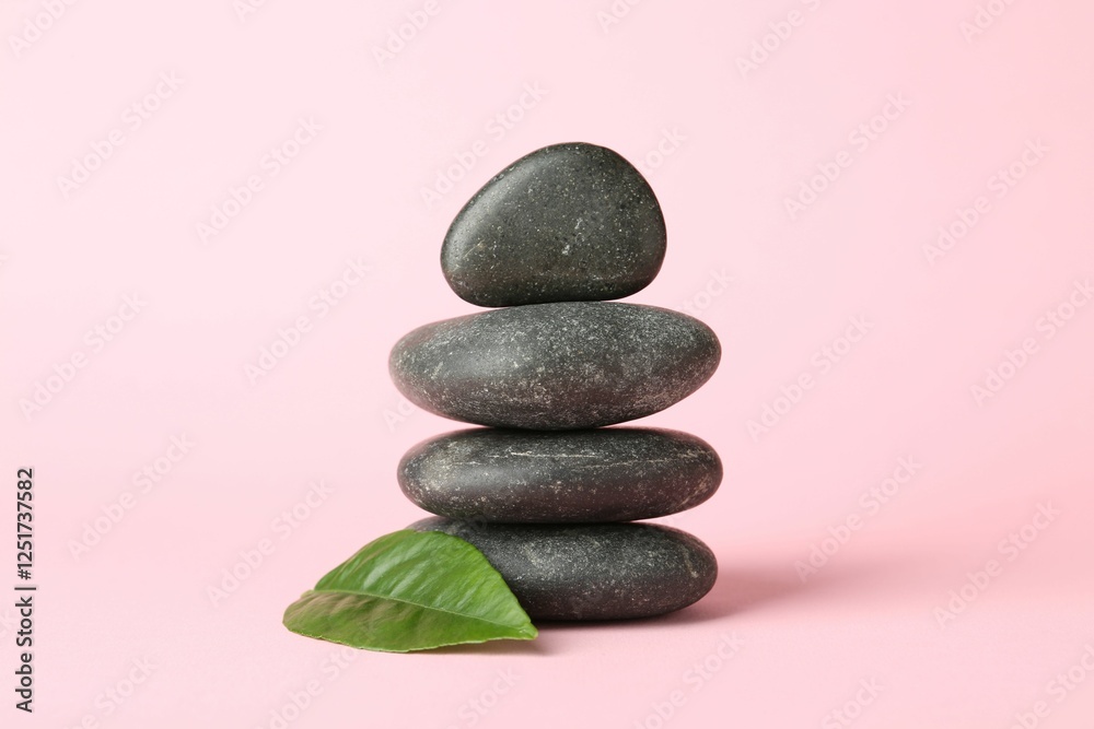 Stack of rocks on light pink background. Harmony and life balance Stack of rocks on light pink background. Harmony and life balance