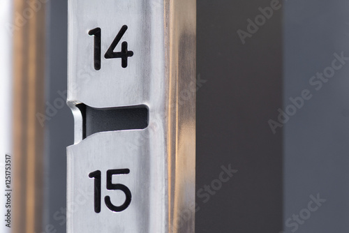 Numbers fourteen fifteen made of stainless steel. Abstract background for inscription.