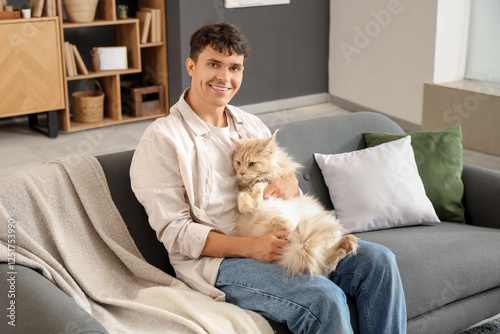 Happy young man cuddling fl...