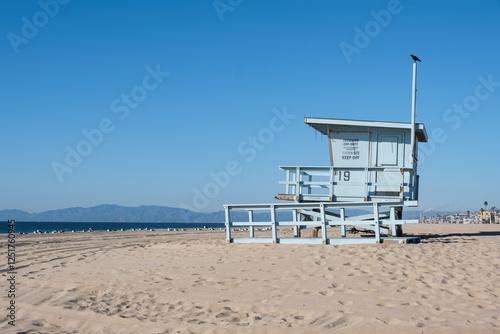 Lifeguard hut/tower between Hermosa beach and Manhattan Beach in Los Angeles, California under a beautiful blue sky