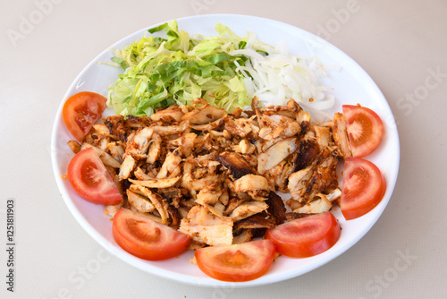 Lavash zurna doner kebab ( zurna  durum )  or shawarma sliced in plate isolated.  hatay usulu tavuk Et doner durum. Gobit ekmek arasi doner. Pilavustu iskender doner kebap.  photo