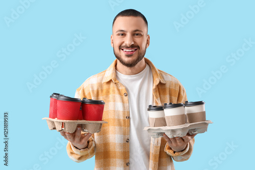 Young man with many paper c...