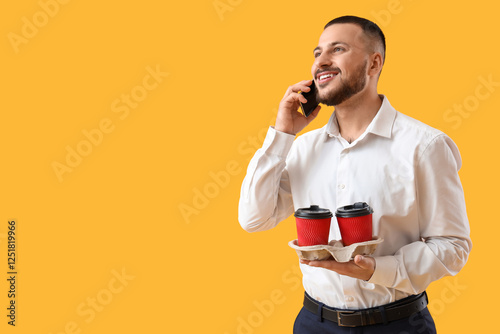 Young man with paper cups o...