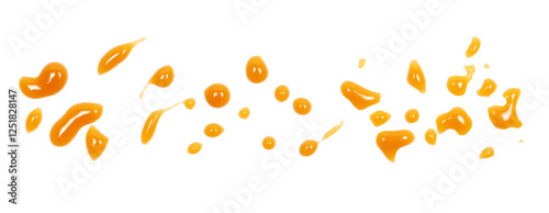 Dessert sauce droplets, caramel flavored topping isolated on white	 photo