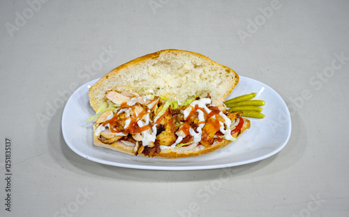 Lavash zurna doner kebab ( zurna  durum )  or shawarma sliced in plate isolated.  hatay usulu tavuk Et doner durum. Gobit ekmek arasi doner. Pilavustu iskender doner kebap.  photo