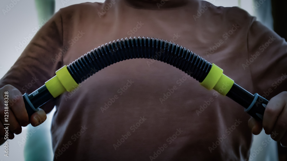 Exercising with a flexible home gym twister bar
