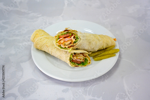 Cuadro en lienzo Lavash doner kebab ( soslu kasarli zurna doner durum )  or shawarma sliced in plate isolated
