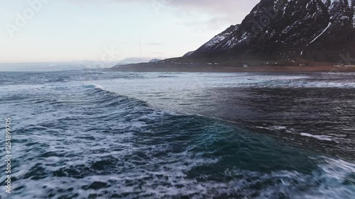 A Beautiful and Serene Coastal Landscape Featuring Majestic SnowCapped Mountains