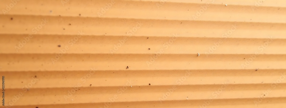 Close-up of textured orange wall surface with horizontal ridges and small dark spots Close-up of textured orange wall surface with horizontal ridges and small dark spots