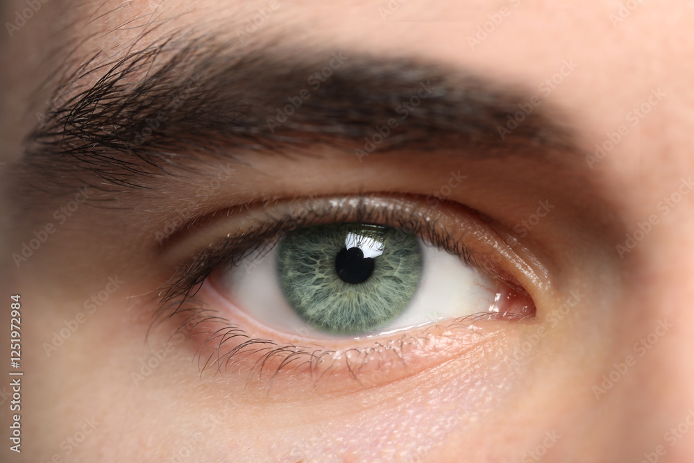 Closeup view of man with green eyes Closeup view of man with green eyes