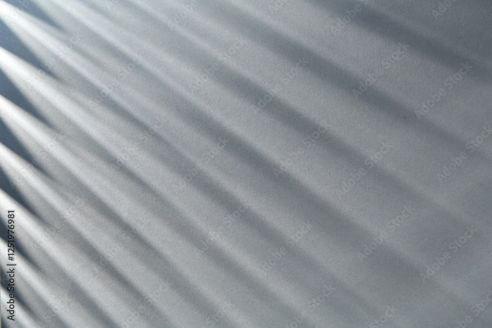 Obraz premium Light and shadows falling on grey background