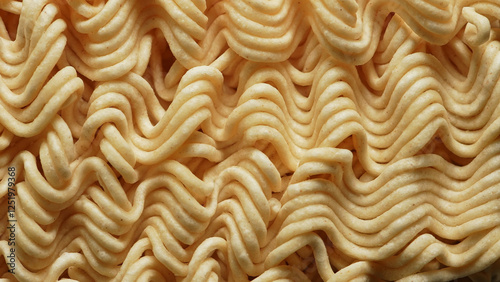 Instant noodle macro shot close up. Ramen noodle for quick soup. Fast food. Popular types of pre-cooked dried noodles. Student and office food made from wheat flour and water. photo