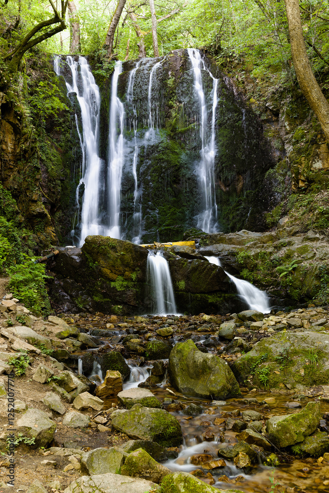 Fototapeta premium Cascades of Koleshino Falls in Belasica Mountains, Novo Selo, Republic of North Macedonia. The size of the waterfall is 15 meters