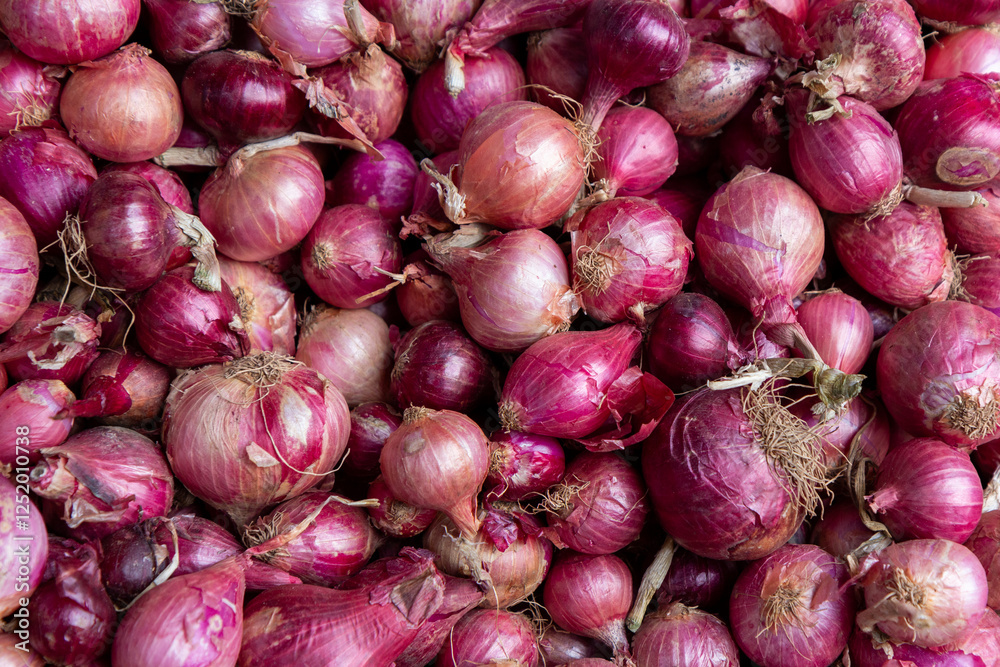 Fresh red onions displayed at a market in Uganda. Fresh red onions displayed at a market in Uganda.