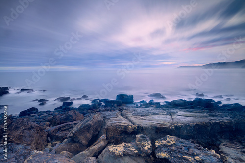 Sunrise on the rock. Watching the sunrise from the seashore is one of the best things you can do to start the day off right.